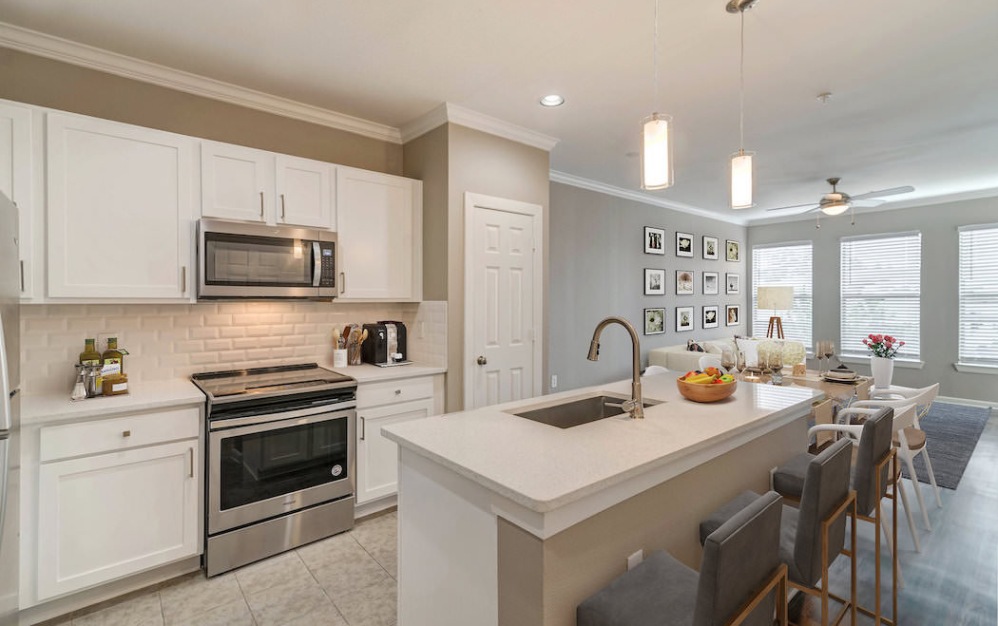 kitchen with an island, ample counter space and modern appliances