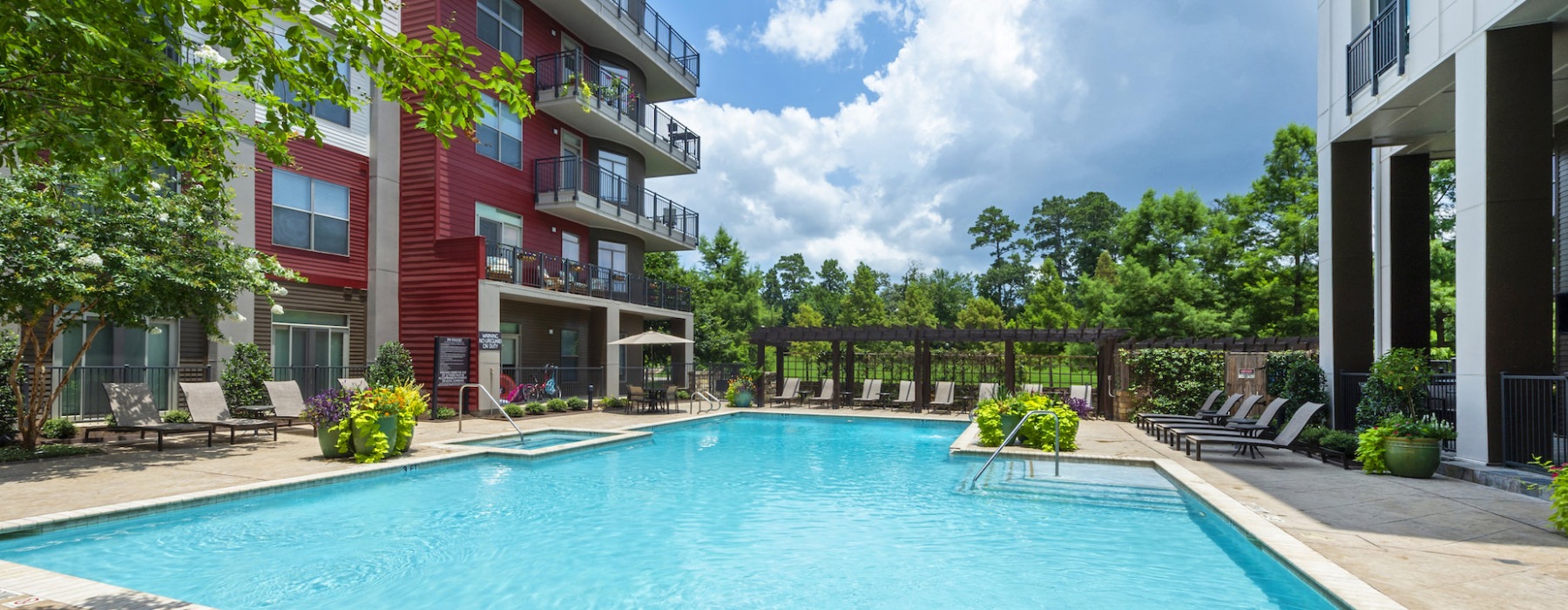 Resort-style swimming pool with lounge seating